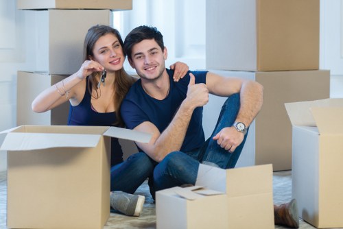 Professional business relocation team handling office equipment in Haringey