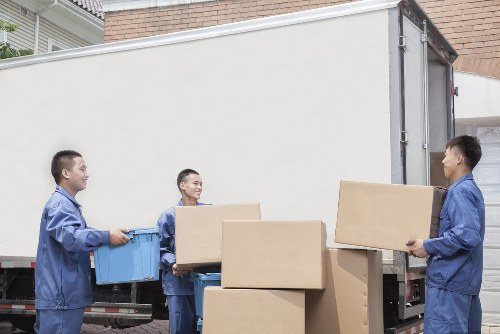 Family settling into a new home after house removals in Haringey