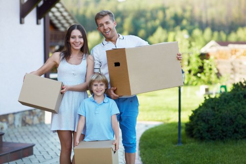 Packed moving boxes and wrapping materials ready for house removals