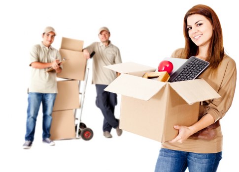 Moving team assessing furniture volume for a quote